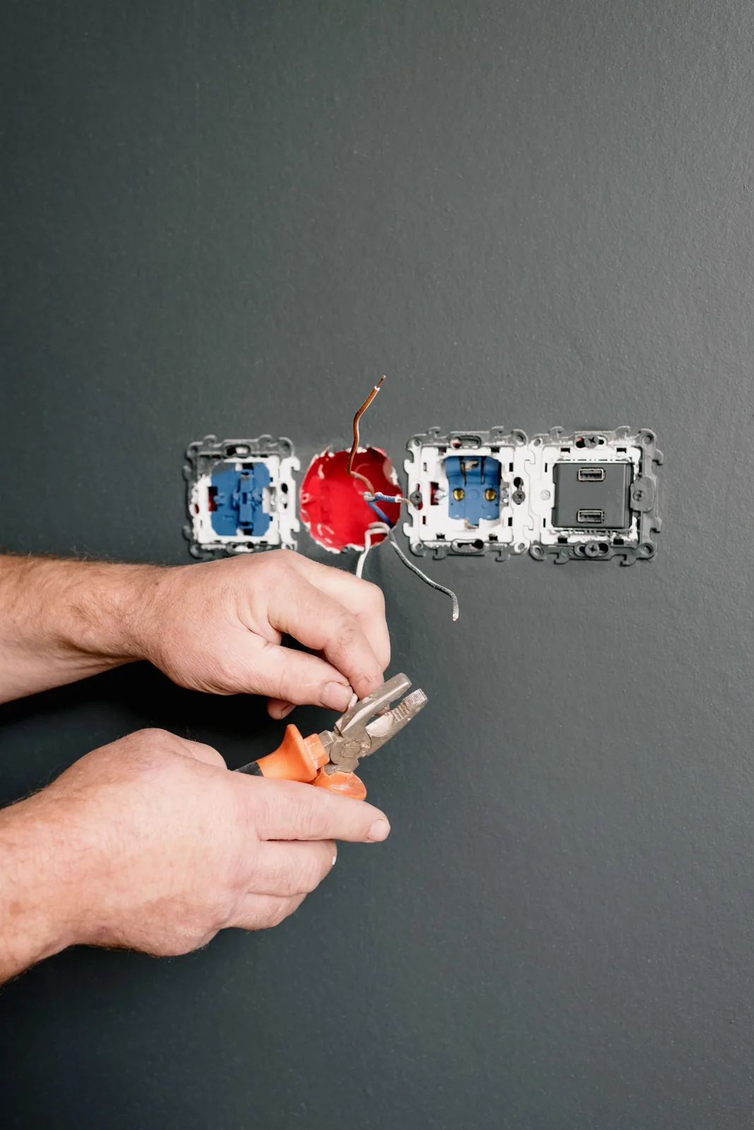 Wiring an outlet box into a finished wall, for code violation in Abbotsford