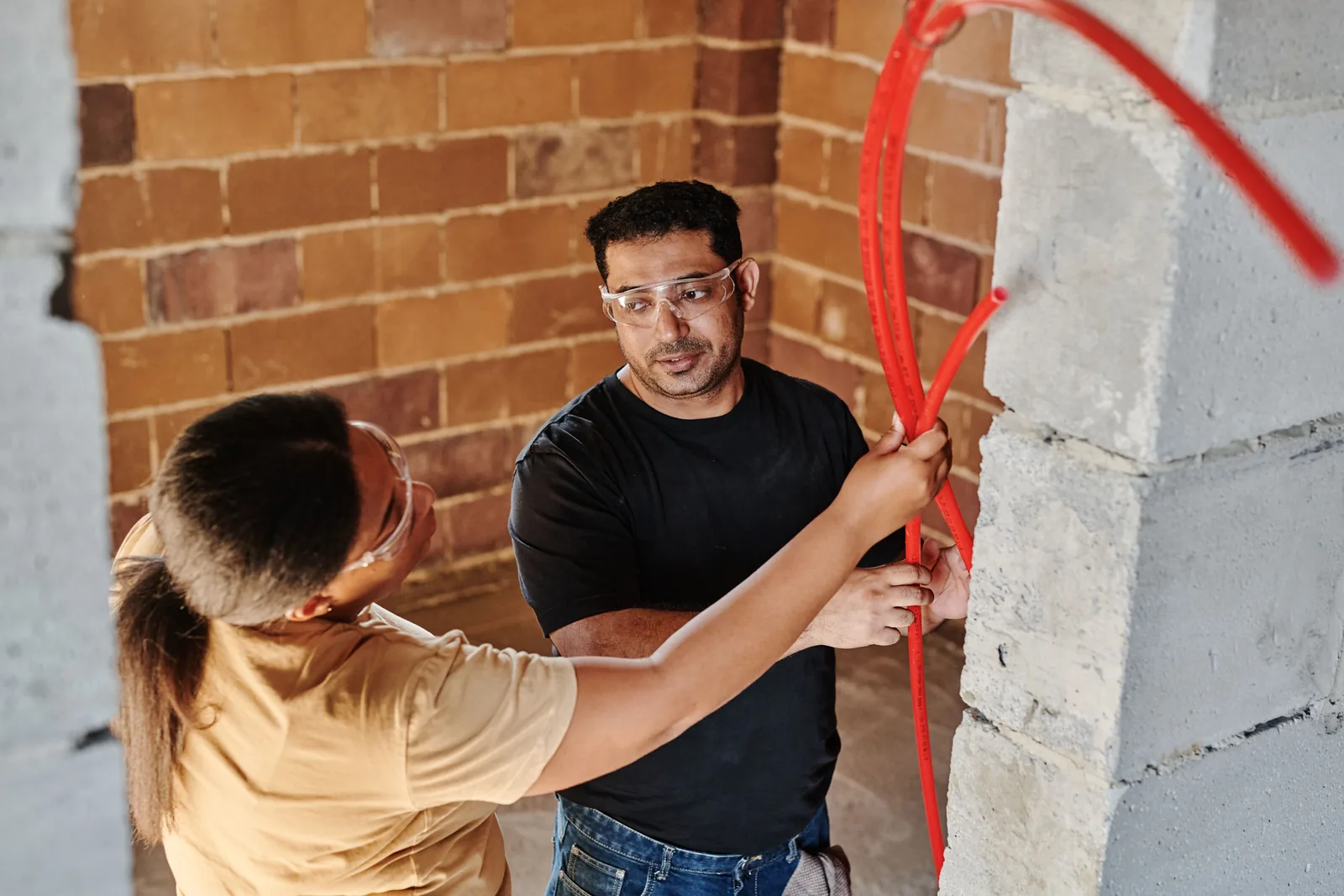 Running conduit across a block wall, for property management electrical in Abbotsford